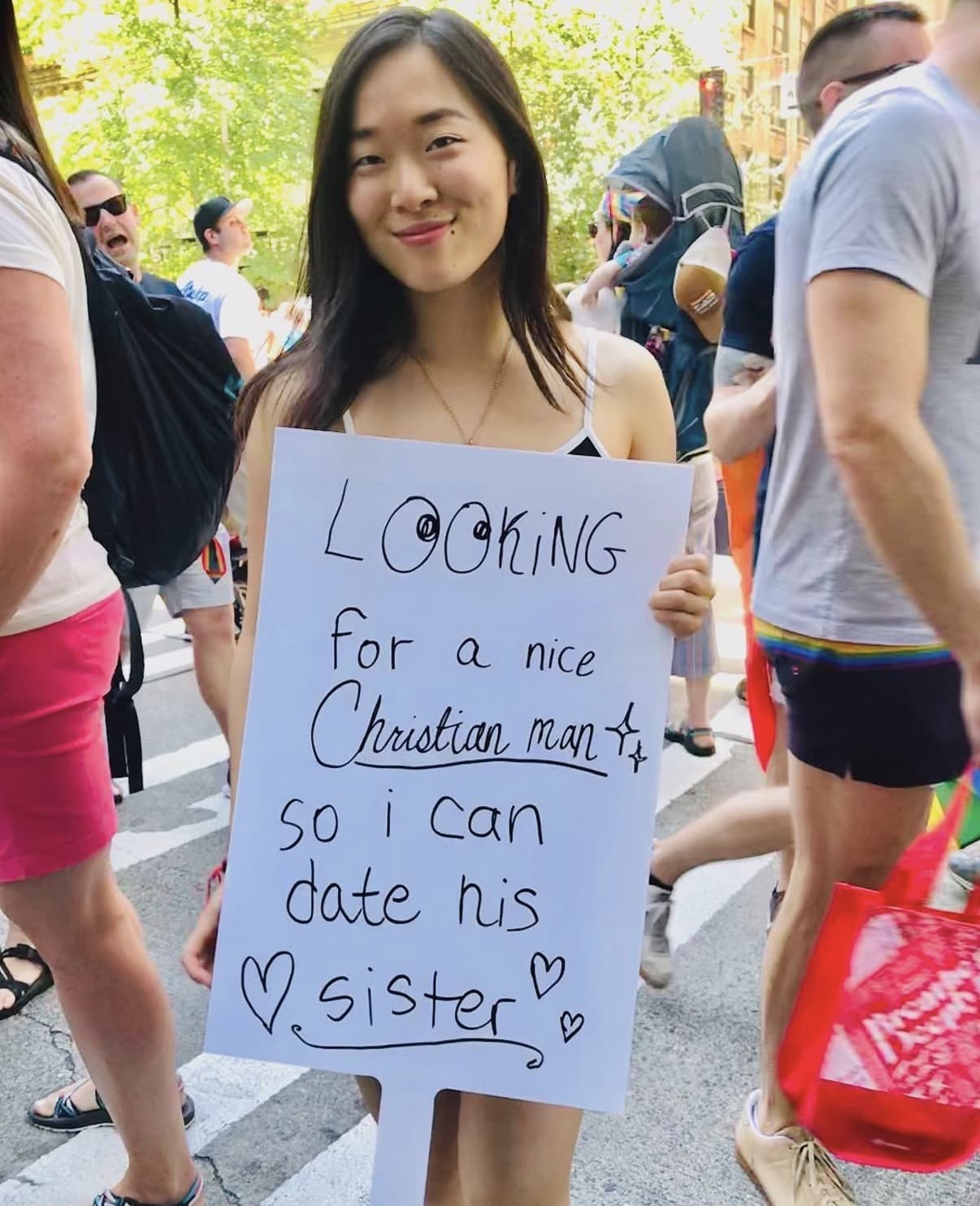 Maddie Wang with lesbian pride sign